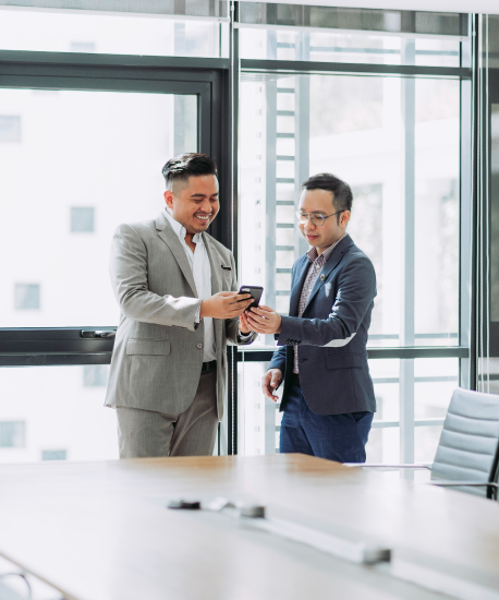 Two businessmen seeing the phone